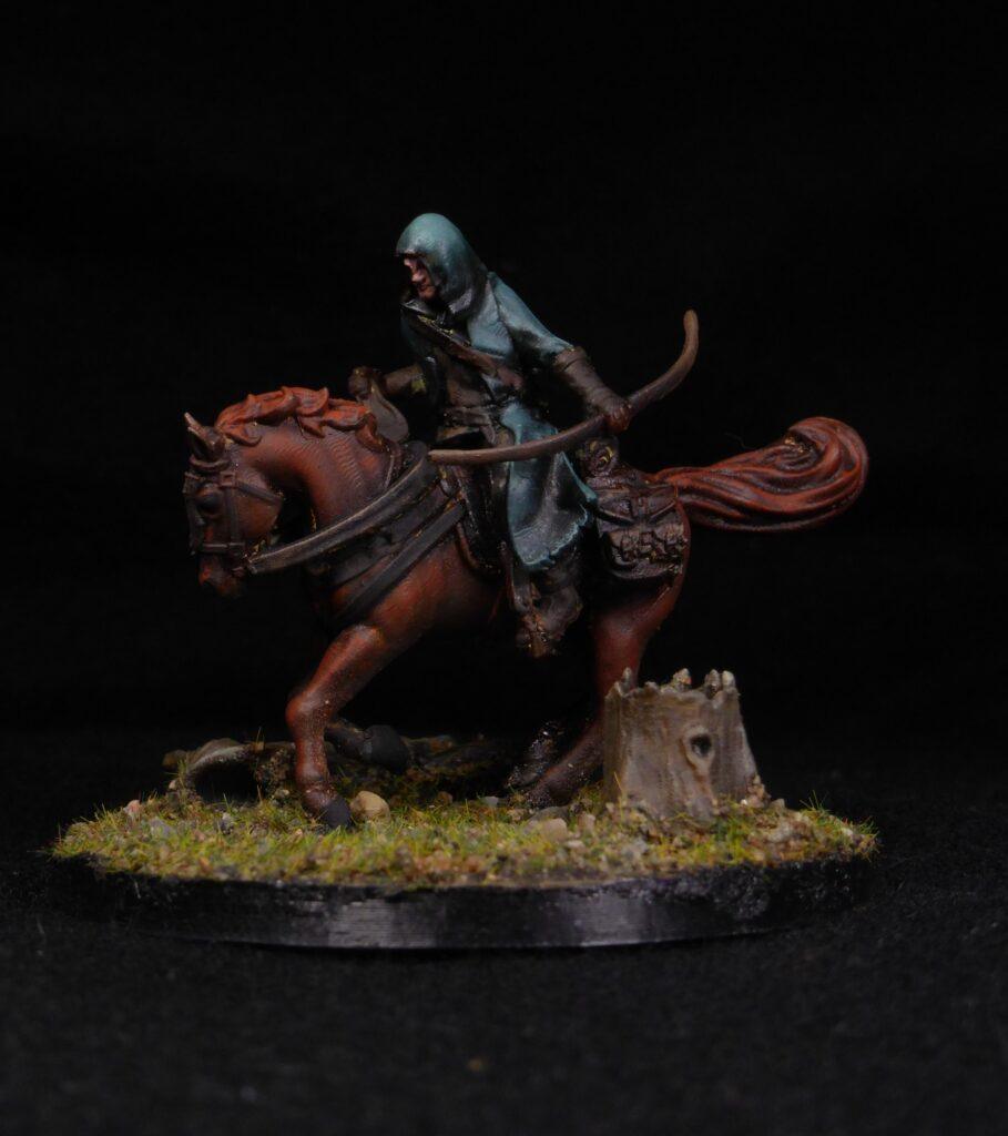 A hooded orc rider 3d printable miniature with a bow, on a bay horse