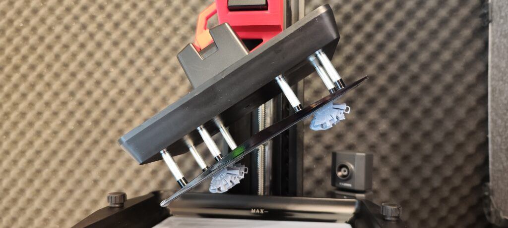 The AmeraLabs Town calibration model on a resin printer's build plate.