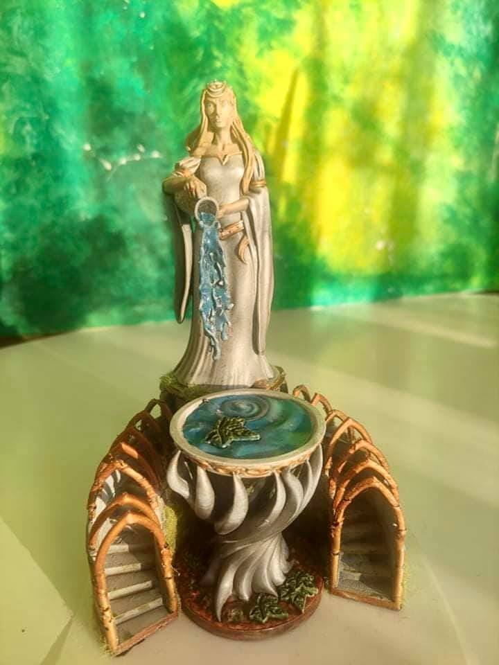 3d pre-supported Galadhiel - Queen 3d painted miniature pours water into the magic vessel.