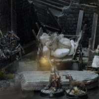 night time town scene diorama with dark rider knocking down the gate door and town guard holding his lantern up to see what is going on