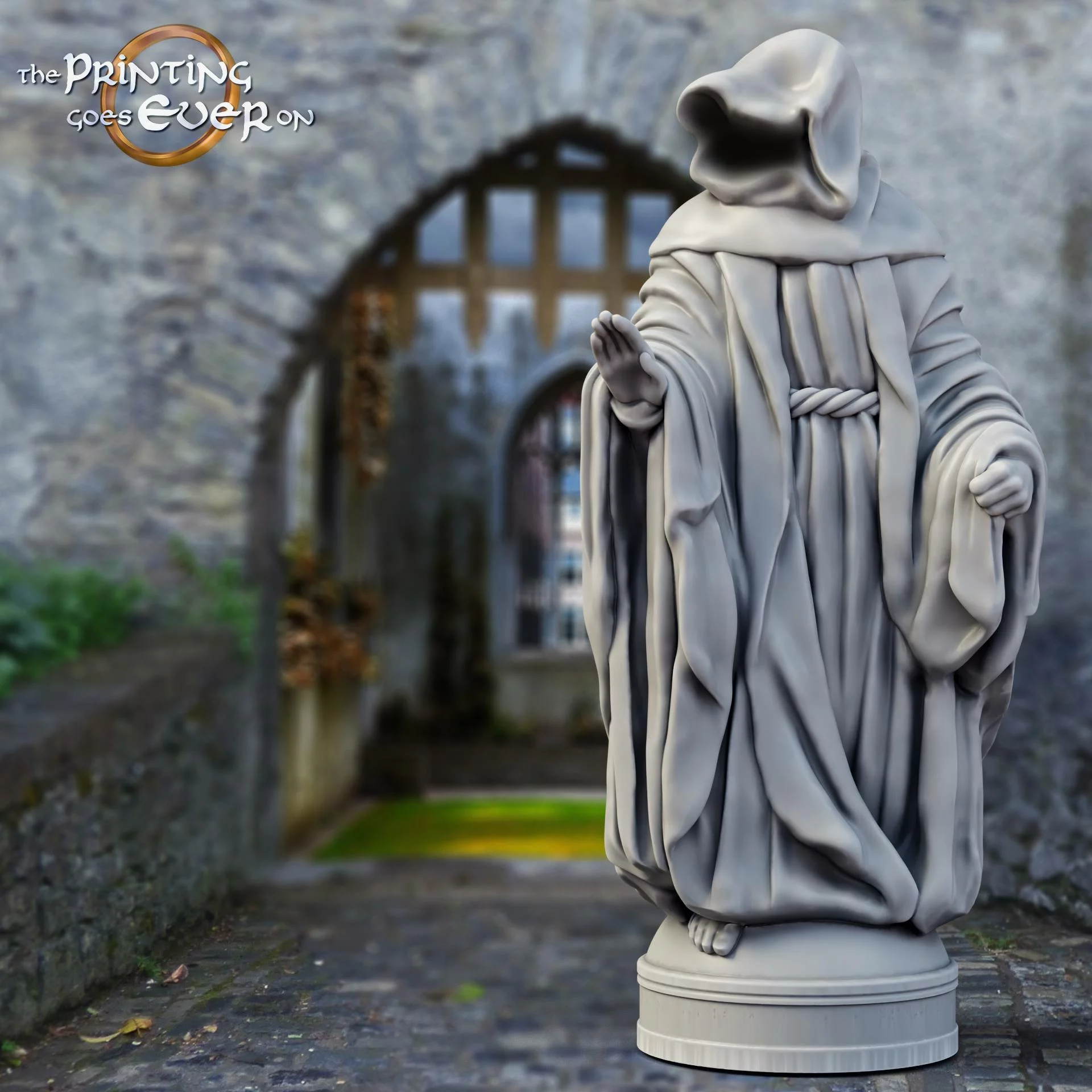 cloaked figure statue