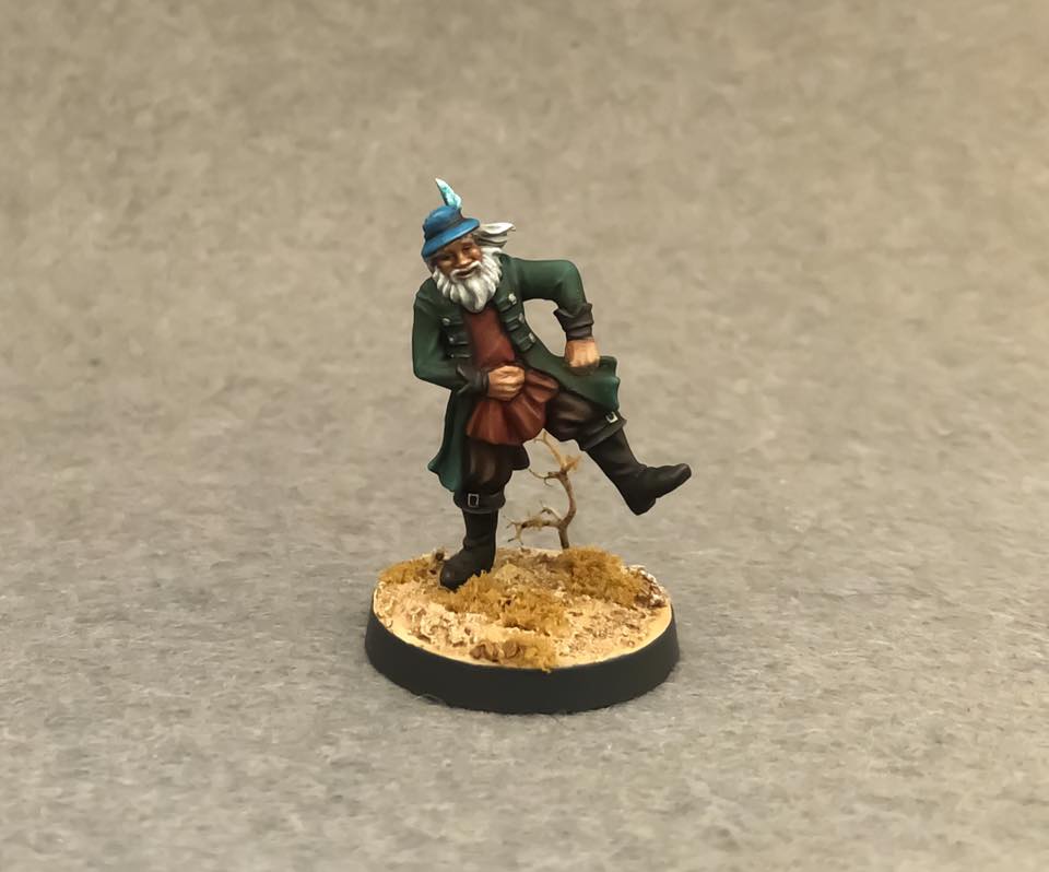 A painted 3d bard, straight from fantasy book, with a hat on his head, dancing on the golden leaves. Base made by Patron.